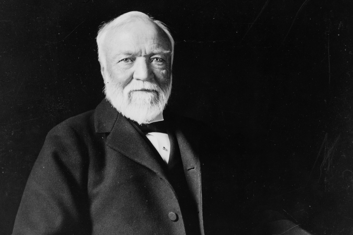 Photo of Andrew Carnegie sitting in chair in front of a black background